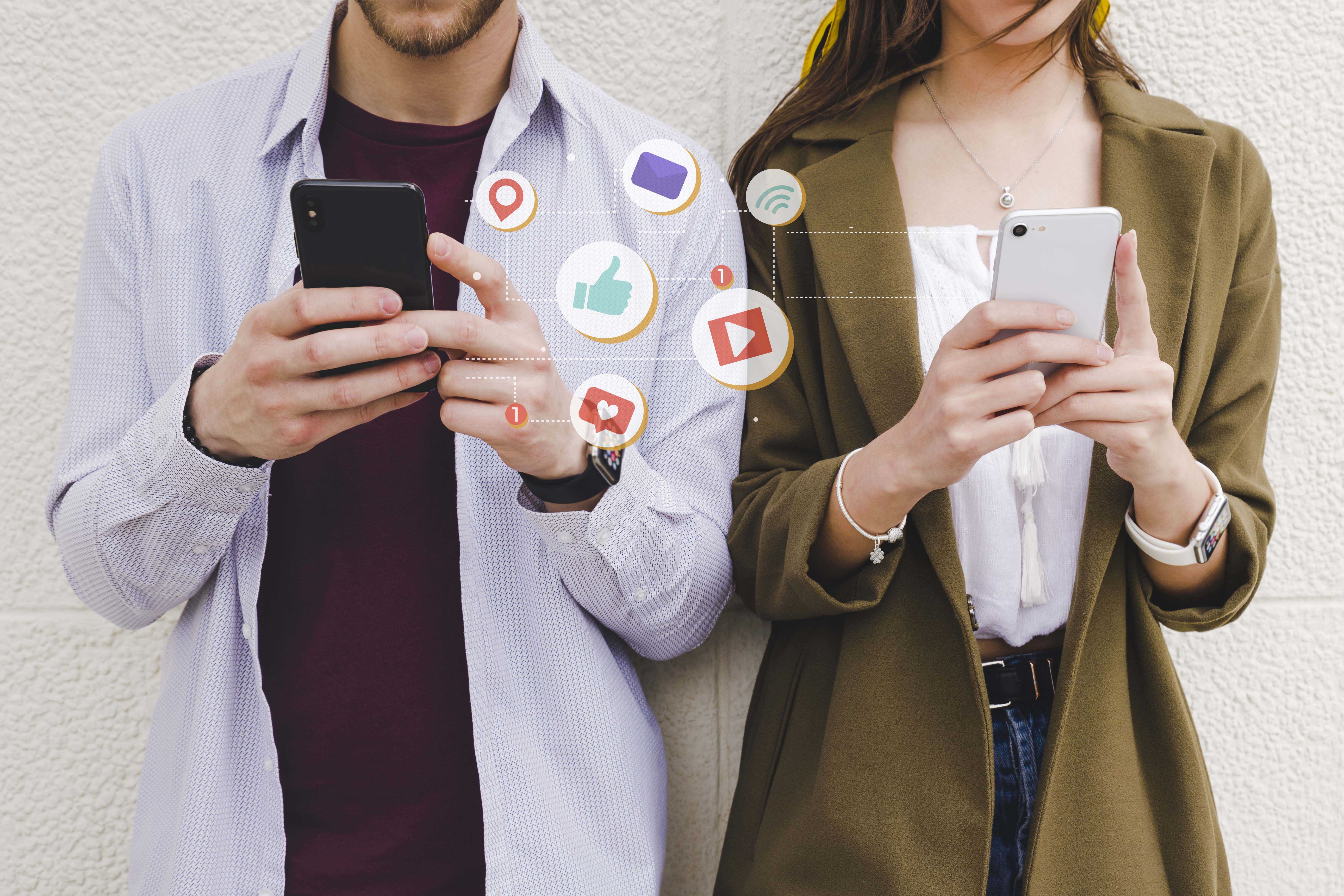 Mobile notification icons man woman using cell phone copy