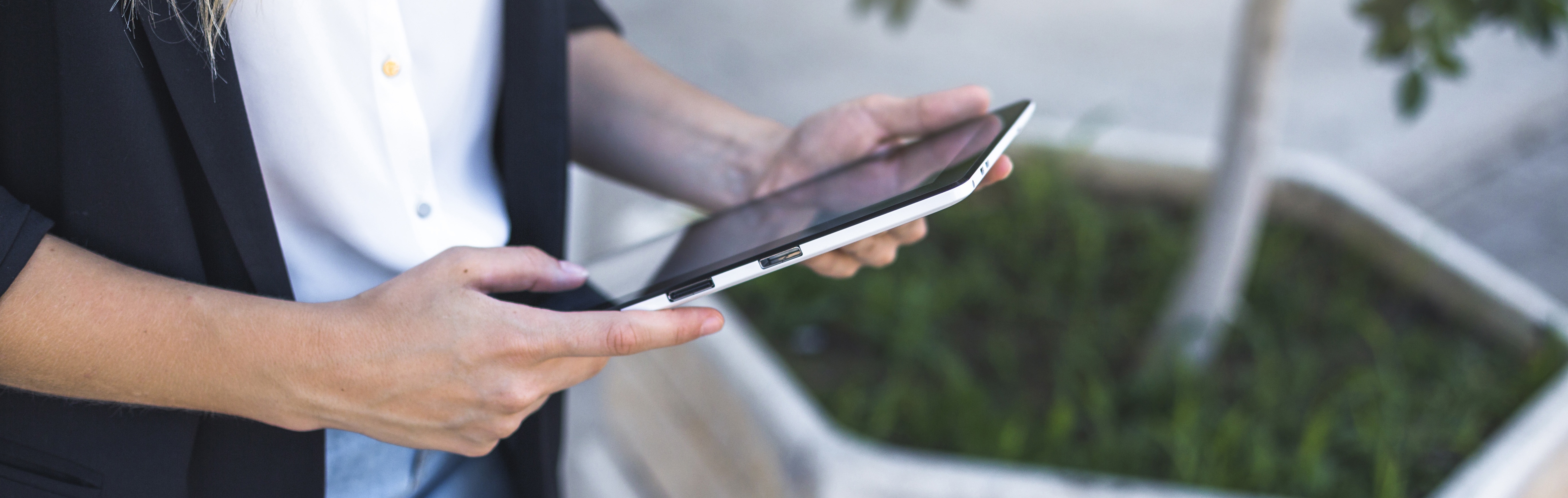 Overhead view woman holding digital tablet copy